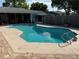 Beautiful private in-ground pool is surrounded by concrete and brick and provides relaxing experience at 11314 Huggins St, Leesburg, FL 34788