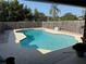 In-ground pool with a concrete deck and fenced yard at 11314 Huggins St, Leesburg, FL 34788
