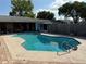 Large, private in-ground pool with ladder and surrounding patio area, perfect for outdoor enjoyment at 11314 Huggins St, Leesburg, FL 34788