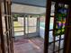 View from the screened porch, showcasing the pool and fenced yard at 11314 Huggins St, Leesburg, FL 34788