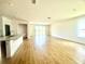 Bright and open-concept living room with tile flooring and sliding glass doors at 131 Addle Hill Ct, Deland, FL 32720