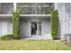 Enclosed patio with outdoor plants with a sliding glass door that looks into the interior living space at 141 Lewfield Circle # 141, Winter Park, FL 32792