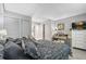 Spacious bedroom showcasing a well-made bed and a dresser with a mirror and decor at 141 Lewfield Circle # 141, Winter Park, FL 32792