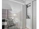 Bedroom with a side table featuring a lamp and decor, also showing closet and laundry area at 141 Lewfield Circle # 141, Winter Park, FL 32792