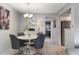 Dining area with a modern table, stylish chairs, and an open view of the kitchen at 141 Lewfield Circle # 141, Winter Park, FL 32792