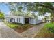 Exterior of building with brick walkways, mature landscaping, and a private entrance at 141 Lewfield Circle # 141, Winter Park, FL 32792