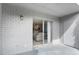 Covered brick patio with sliding glass door that looks into the interior living space at 141 Lewfield Circle # 141, Winter Park, FL 32792