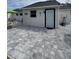 The expansive paved backyard offers a unique entertaining space at 1620 Hialeah St, Orlando, FL 32808
