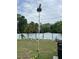 Backyard is grass-covered and partially fenced with trees along the perimeter at 1620 Hialeah St, Orlando, FL 32808