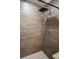 Updated shower showcasing tile walls, shower head and modern fixtures at 1620 Hialeah St, Orlando, FL 32808