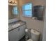 This is a well-lit bathroom with modern fixtures and granite countertop at 1620 Hialeah St, Orlando, FL 32808