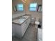 Well-lit bathroom features double sinks with granite countertops and tile flooring at 1620 Hialeah St, Orlando, FL 32808