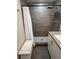 Updated bathroom featuring modern shower, granite countertop and modern fixtures at 1620 Hialeah St, Orlando, FL 32808