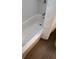 Image of a bright bathtub with a shower and a tiled floor at 1620 Hialeah St, Orlando, FL 32808
