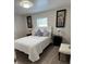Charming bedroom with unique wall art and stylish lamps at 1620 Hialeah St, Orlando, FL 32808
