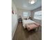 Bedroom with a window, tiled floors and decorated with cartoon art at 1620 Hialeah St, Orlando, FL 32808