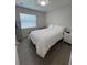 Bright bedroom with a large window and tile flooring at 1620 Hialeah St, Orlando, FL 32808