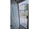 The front door leads into the house with a view to the paved front yard at 1620 Hialeah St, Orlando, FL 32808