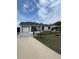 Inviting single-story home with a well-maintained lawn and a cozy front porch at 1620 Hialeah St, Orlando, FL 32808