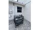 Exterior corner featuring AC unit, pavers, and small window at 1620 Hialeah St, Orlando, FL 32808