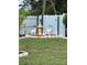 Lawn with garden decorations, including deer, a cow, chickens, a lighthouse, and a statue at 1620 Hialeah St, Orlando, FL 32808