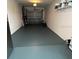 The spacious garage is equipped with shelving and a rolling door at 1620 Hialeah St, Orlando, FL 32808