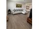 Bright living room features a sectional sofa and wood-look tile flooring at 1620 Hialeah St, Orlando, FL 32808