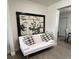 Cozy seating area features a white futon and decorative wall art at 1620 Hialeah St, Orlando, FL 32808