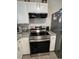 The kitchen features a stainless steel oven and granite countertops at 1620 Hialeah St, Orlando, FL 32808