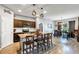 Open kitchen with a large island and dining area. It features modern appliances and plenty of counter space at 16406 Blooming Cherry Dr, Groveland, FL 34736