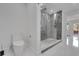 Bright bathroom featuring a new toilet and glass shower at 1700 Lake Markham Rd, Sanford, FL 32771