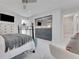 Airy bedroom with sleek closet doors, comfortable bed, and modern décor for a serene retreat at 1700 Lake Markham Rd, Sanford, FL 32771