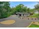 Stunning exterior of modern home with dark trim, featuring a long driveway and beautiful landscaping with lake views at 1700 Lake Markham Rd, Sanford, FL 32771