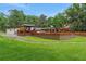 Spacious outdoor deck with bar and seating areas, perfect for entertaining and relaxing outside at 1700 Lake Markham Rd, Sanford, FL 32771
