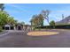 Lovely front exterior featuring a well-manicured lawn and a spacious driveway with circle detail at 1700 Lake Markham Rd, Sanford, FL 32771
