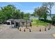 Beautiful exterior showcasing the landscaping, circular driveway and the home's modern design near the lake at 1700 Lake Markham Rd, Sanford, FL 32771