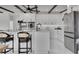 Bright kitchen with a large island, white cabinetry, and stainless steel refrigerator at 1700 Lake Markham Rd, Sanford, FL 32771
