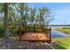 Wooden deck overlooking the lake, perfect for relaxation and enjoying the waterfront view at 1700 Lake Markham Rd, Sanford, FL 32771