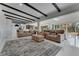 Spacious living room with high ceilings, modern decor, and seamless access to the outdoor living area by the lake at 1700 Lake Markham Rd, Sanford, FL 32771