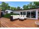 Comfortable outdoor seating area with a plush sectional sofa on a spacious wooden deck at 1700 Lake Markham Rd, Sanford, FL 32771