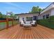 Relaxing outdoor seating area with two chairs and a small table on a wooden deck at 1700 Lake Markham Rd, Sanford, FL 32771