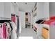 A well-organized walk-in closet with shelving and hanging space at 1700 Lake Markham Rd, Sanford, FL 32771