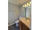 Classic bathroom featuring a pedestal sink, toilet, and neutral tile flooring at 1754 Fritwell Ct, Ocoee, FL 34761
