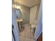 Well-maintained bathroom with a pedestal sink, toilet, and neutral paint at 1754 Fritwell Ct, Ocoee, FL 34761