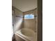 Stylish bathroom featuring a soaking tub and a shower with glass doors at 1754 Fritwell Ct, Ocoee, FL 34761
