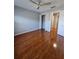 Bedroom with hardwood floors, ceiling fan and closet at 1754 Fritwell Ct, Ocoee, FL 34761