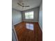 Bedroom with hardwood floors, ceiling fan and window at 1754 Fritwell Ct, Ocoee, FL 34761