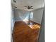 Sun-drenched bedroom with beautiful wood floors and a modern ceiling fan at 1754 Fritwell Ct, Ocoee, FL 34761