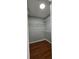 Walk-in closet featuring modern wood floors and plenty of shelving at 1754 Fritwell Ct, Ocoee, FL 34761