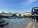 Community pool surrounded by lounge chairs and townhome style condos at 1754 Fritwell Ct, Ocoee, FL 34761